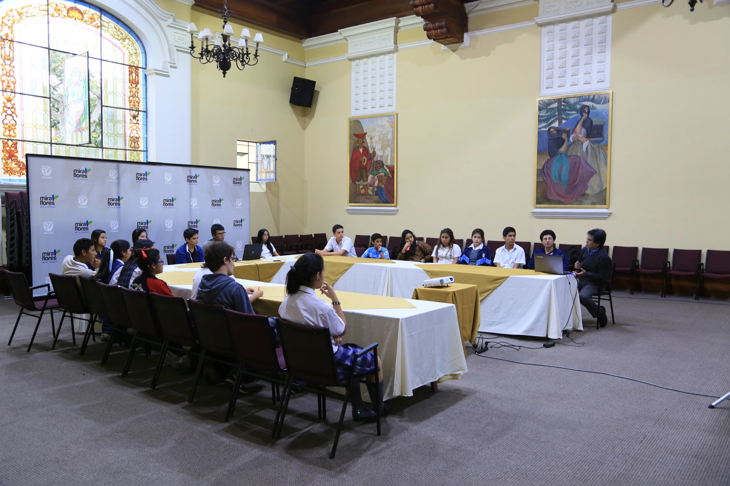 a group of people sitting at tables in a room