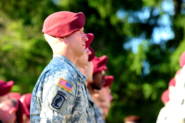 a soldier stands in front of other soldiers