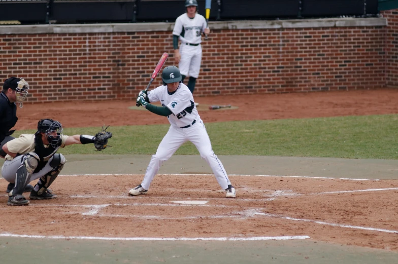 a baseball player that is standing in the dirt