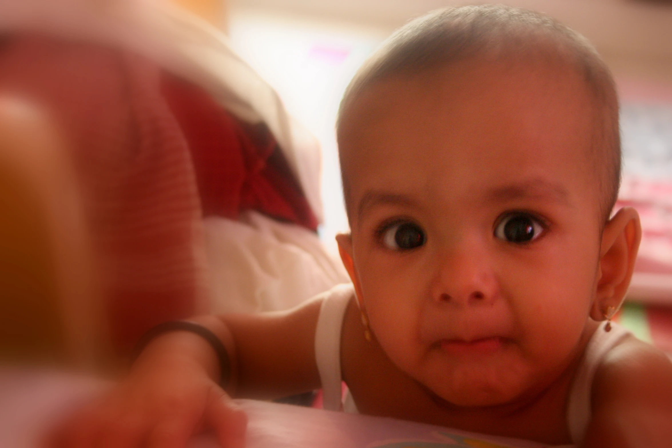 a close up of a baby looking at the camera