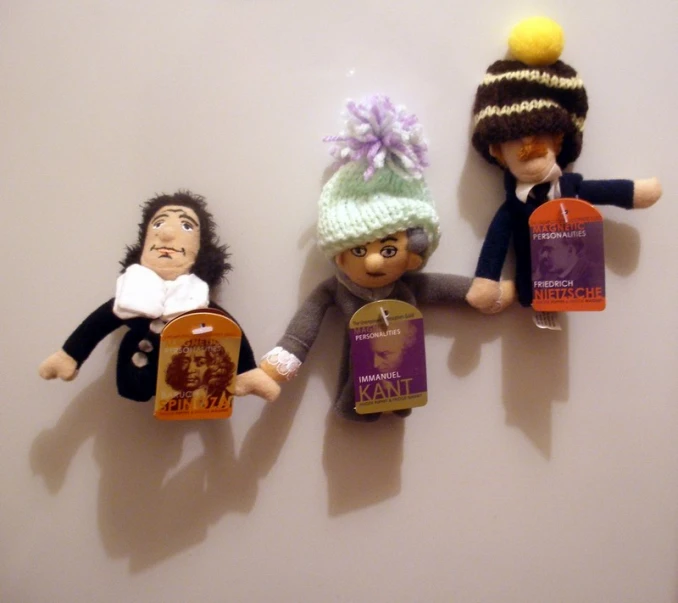several different style dolls on a wall
