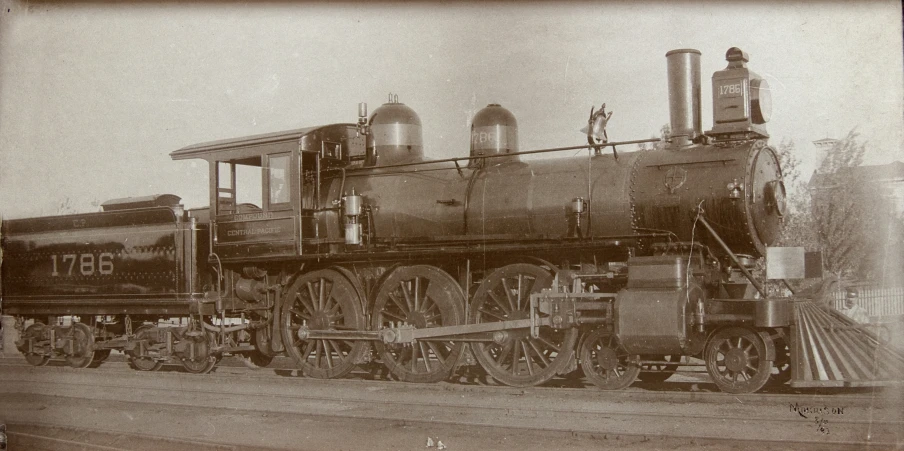 an old train is on the tracks in black and white