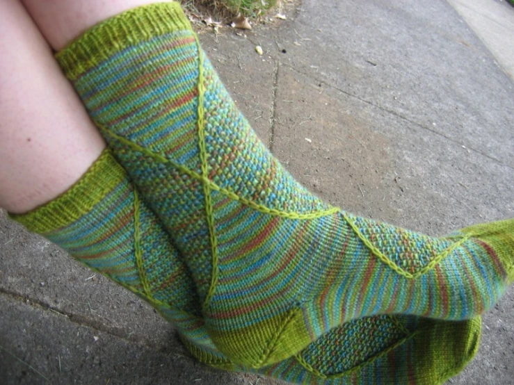 someone wearing green socks with green and blue stripes