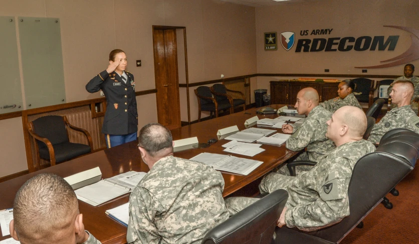 an officer giving a presentation in the board room