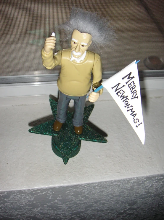 the figurine shows a man with a sign