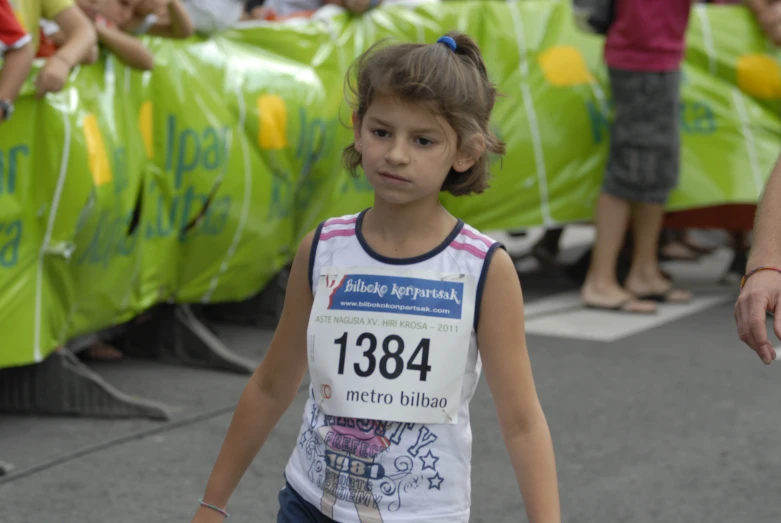  walking in the street with numbered numbered race bib