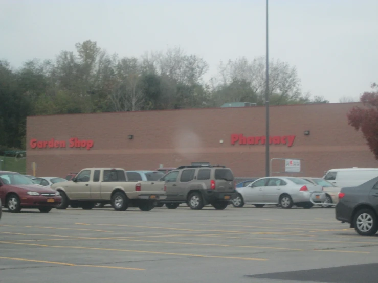 a parking lot in front of a business on a cloudy day