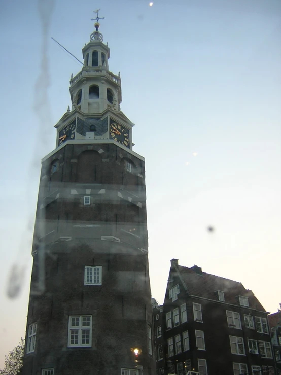 the clock tower is built into the side of the building