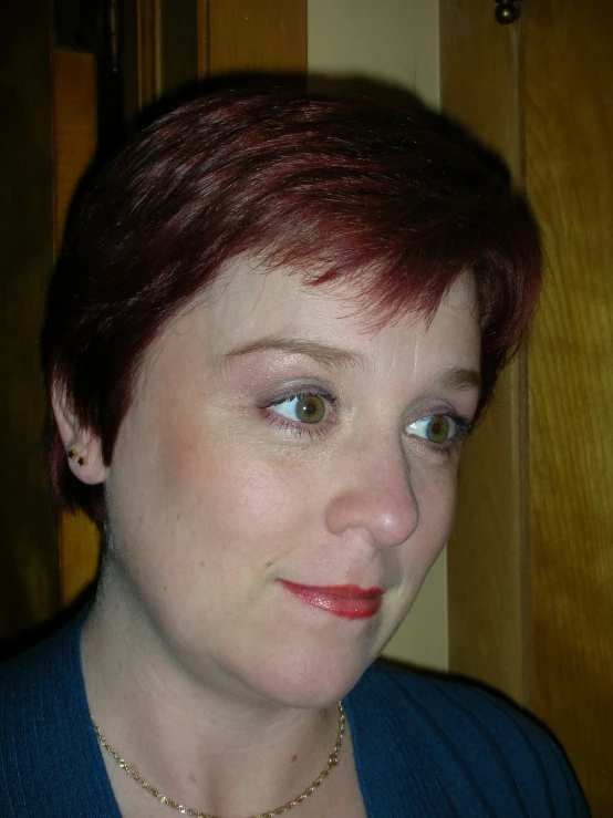 a women with very short hair looks to the side