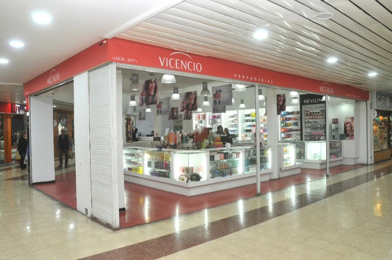 a store inside of an airport building with a large display on the front