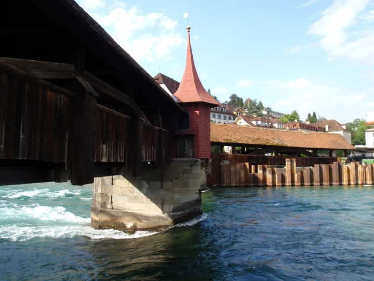 a bridge is seen over the water near buildings