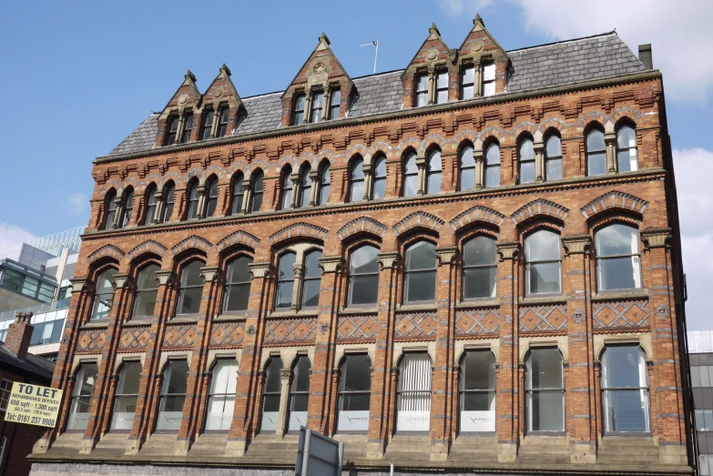 a tall brick building with lots of windows