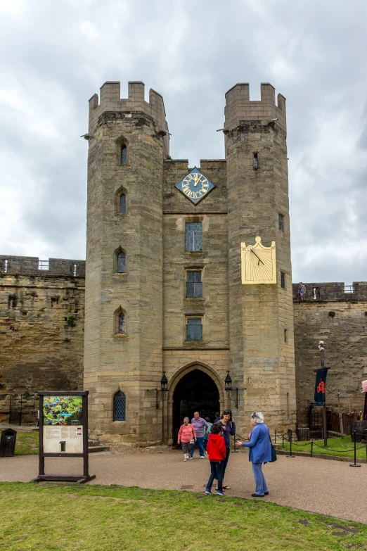 a large castle like building with a clock on it's side