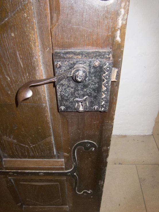 a door with some metal latch on it