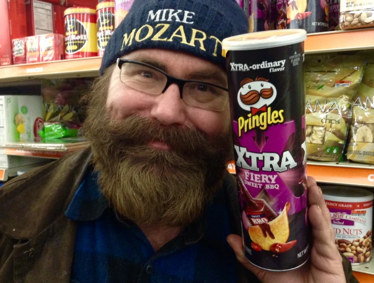 a bearded man with a mohawk and a fake nutella drink