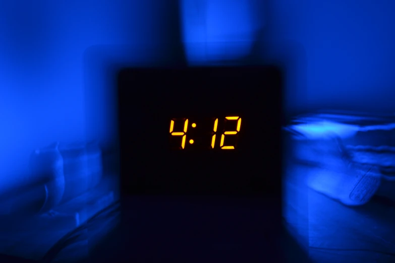 a clock that reads 11 38 in the dark