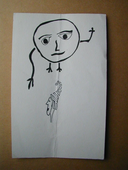 an image of a piece of paper with some drawing of a hand holding soing