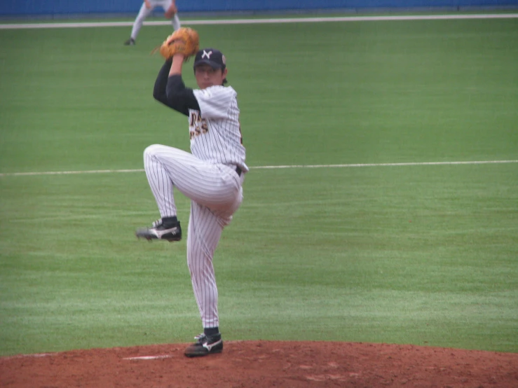 a man throwing a baseball on a field