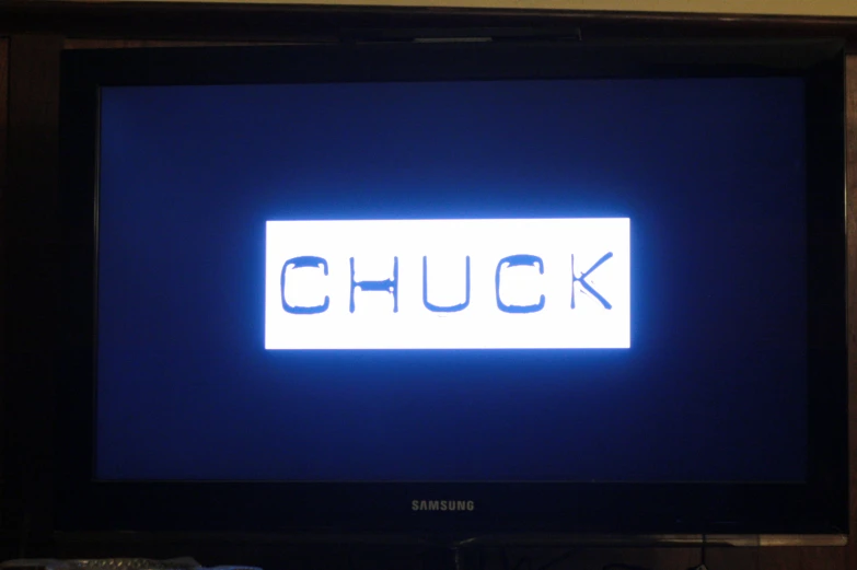 a television screen is lit up with the word chuck