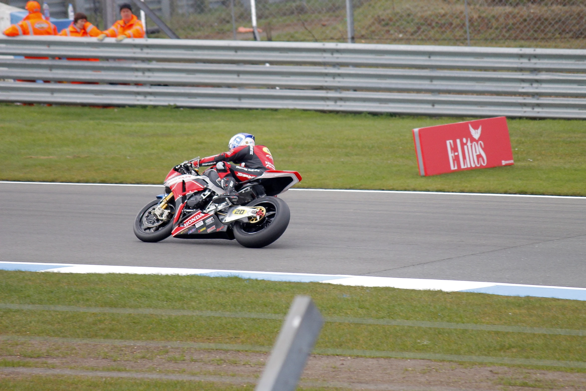 a man riding a motorcycle on top of a track