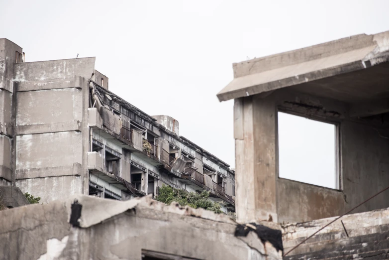 some buildings with lots of debris on top of it