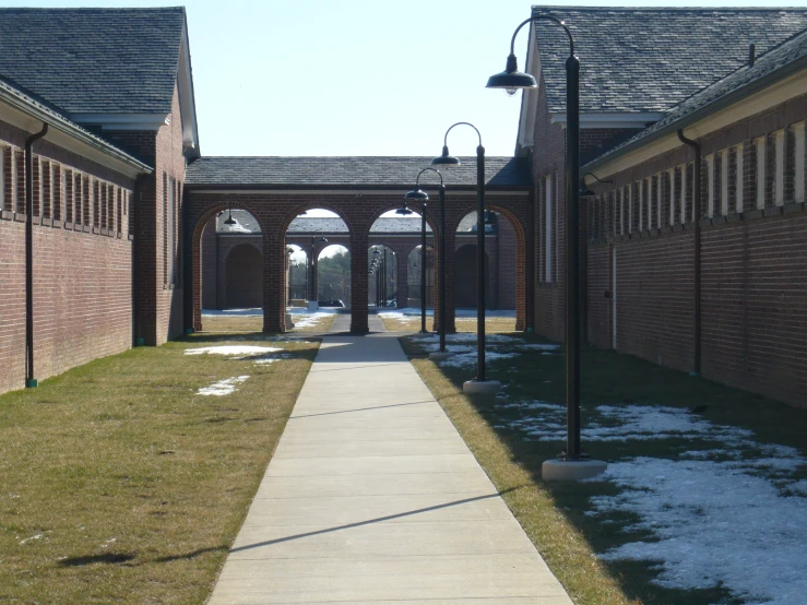a walkway leads to an old style brick building