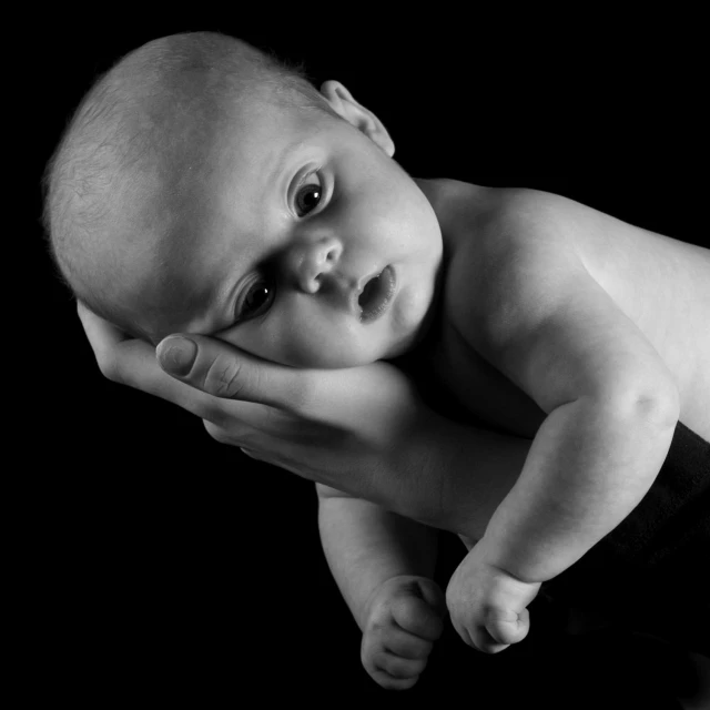 a black and white pograph of a baby