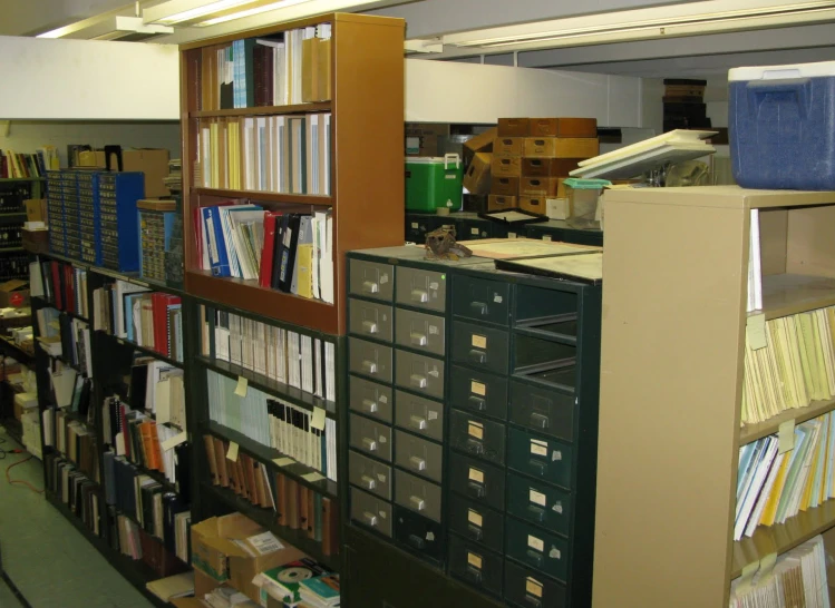 an office filled with shelves and many files