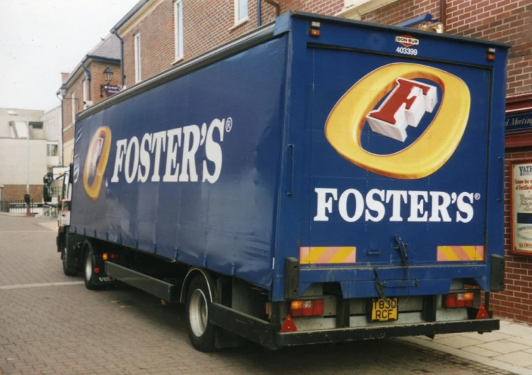 a fast food delivery truck is parked in front of a store