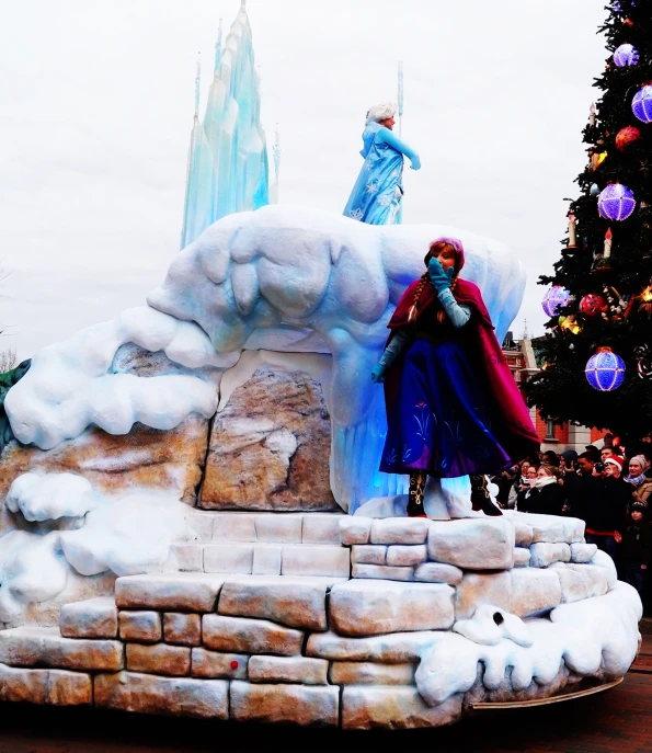 an ice castle with a statue on top