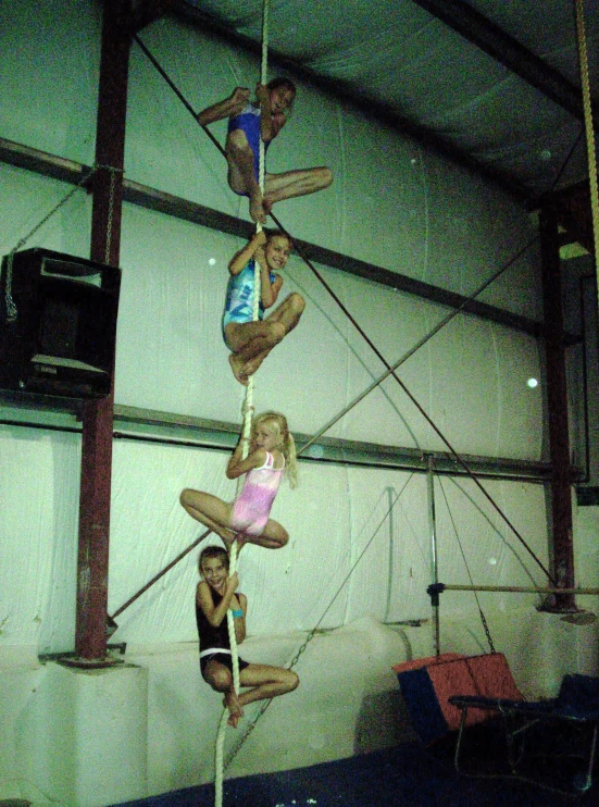 the girls are practicing acrobatics and yoga in the ring