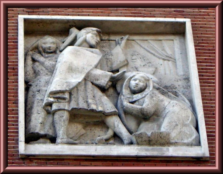 this sculpture is on the corner of a building