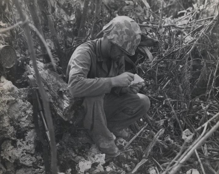 an old picture shows a soldier wearing camouflage clothing