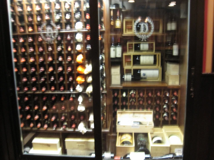 an assortment of wine bottles in a cellar