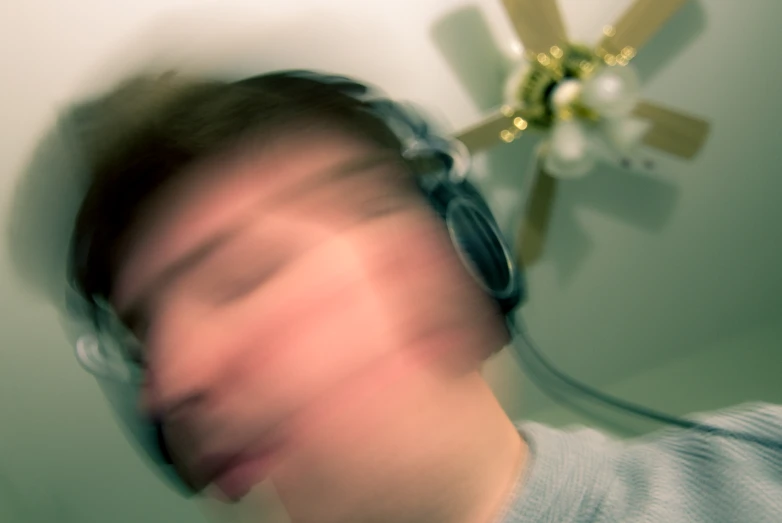blurry pograph of a man with headphones