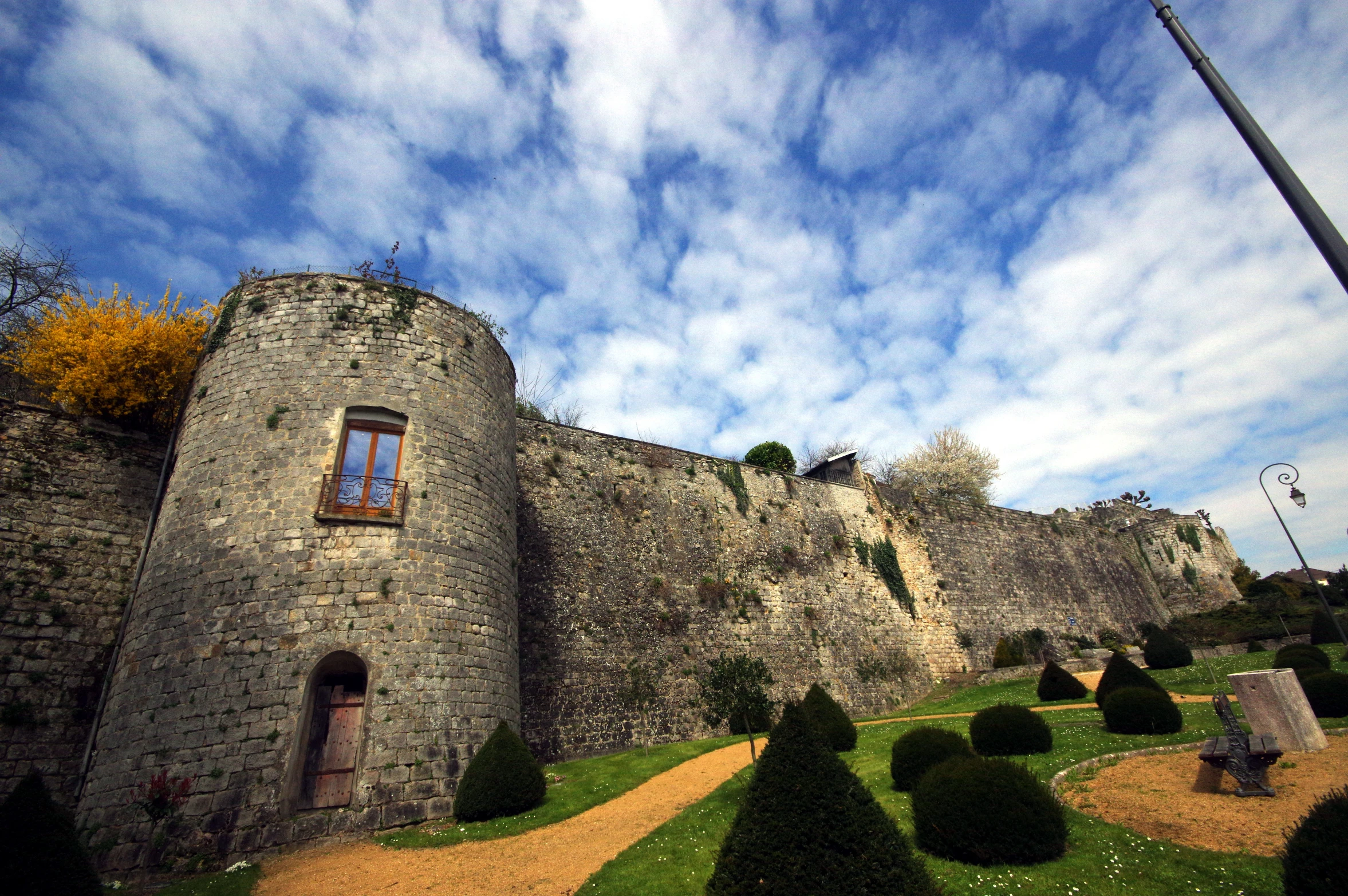 a large castle on the hill with a nice lawn