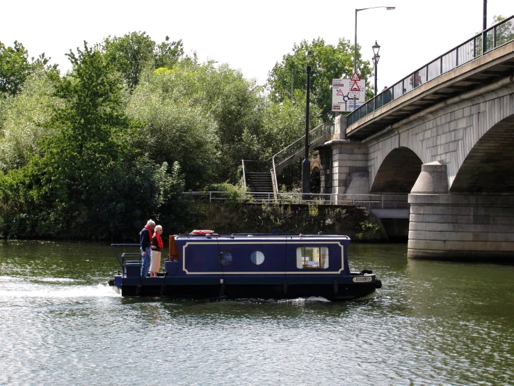 a boat moving down the river with its passengers