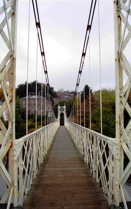 a view of a very long bridge in the middle of the day