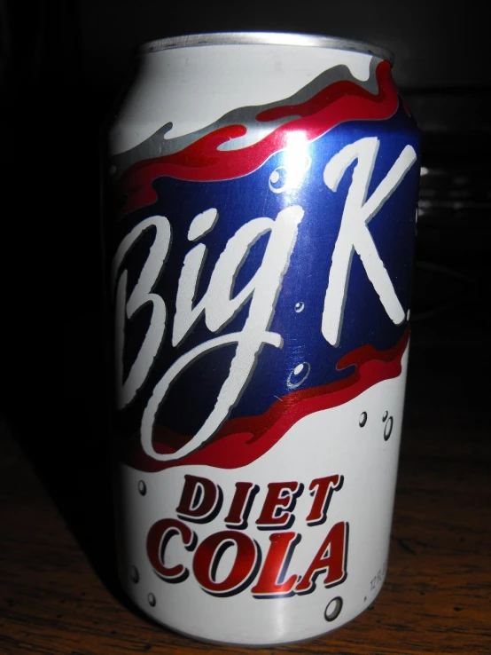 a canned diet cola sitting on top of a wooden table