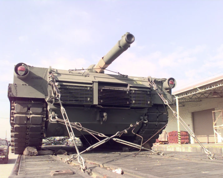 there is a large black tank sitting on the trailer