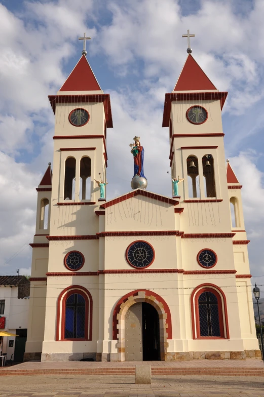 an old white church with two large steeples