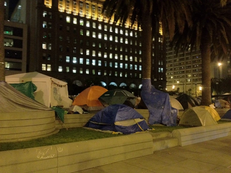 many tents are set up in front of a building