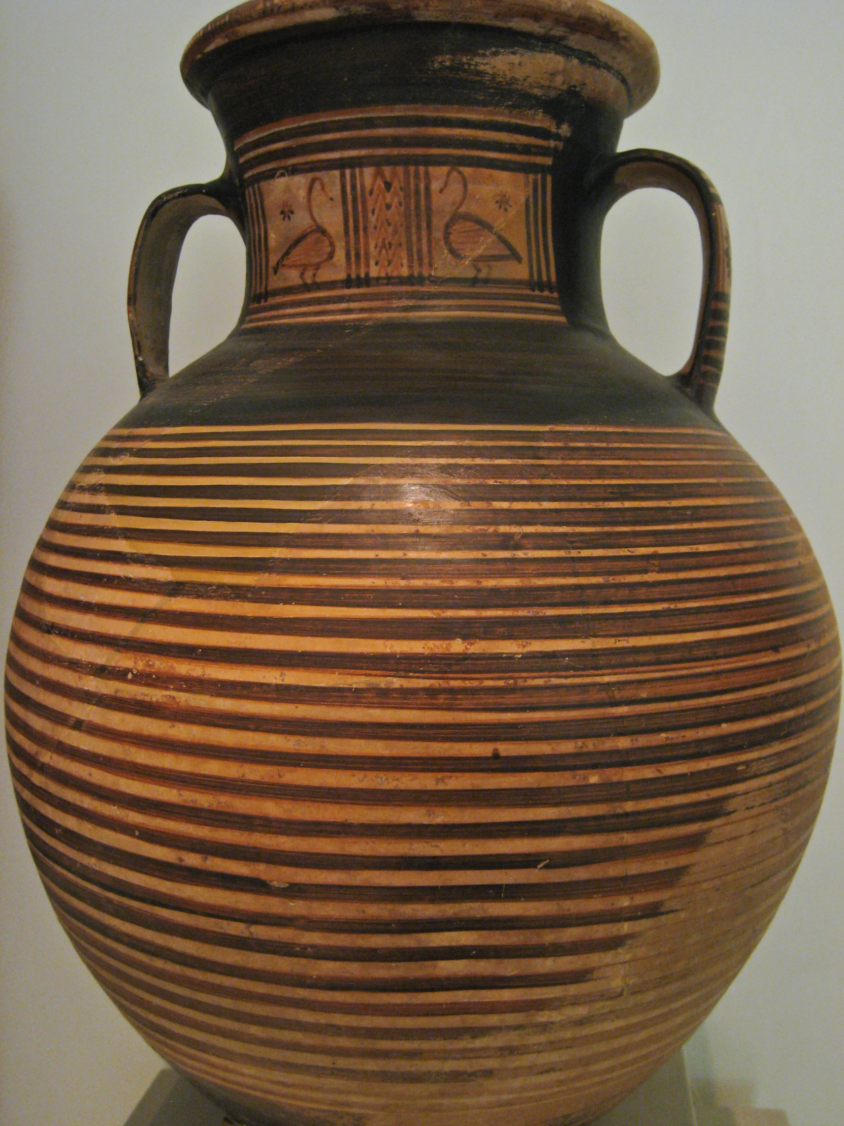 an antique looking ceramic vase is on display