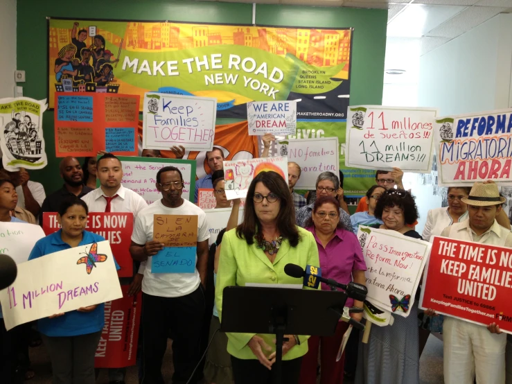 a group of people that are holding signs