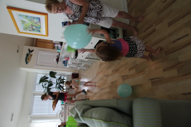 two adults and one small child in a living room