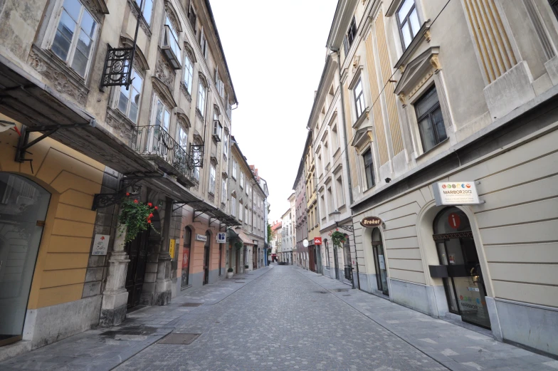 there is an empty alley leading to a building