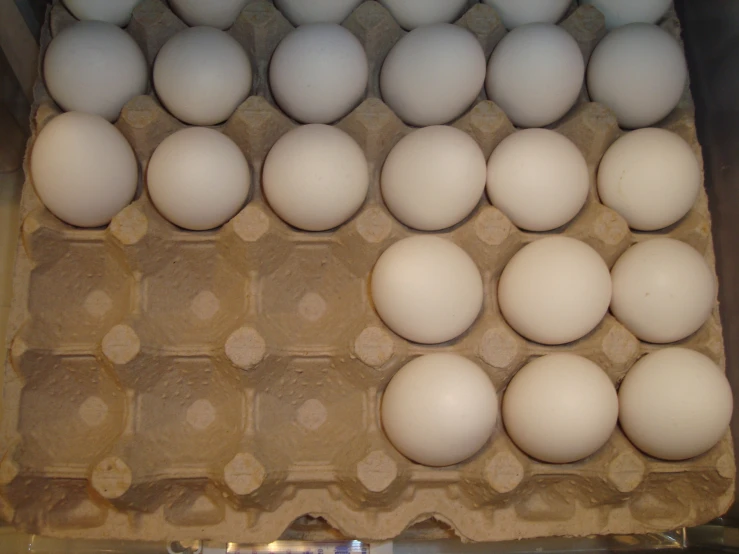 a carton with dozens of eggs in it