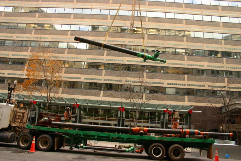 a tractor trailer is moving through the city