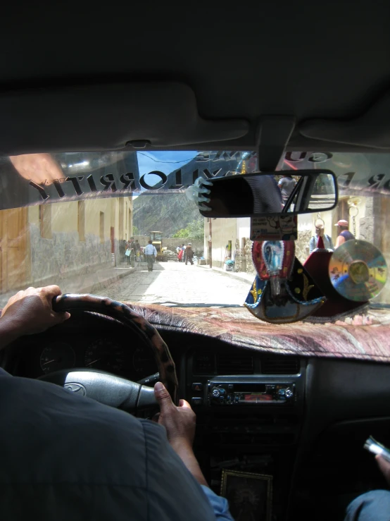 a person driving an automobile on the road