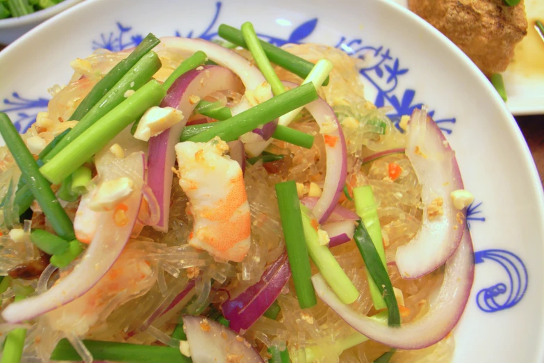 a seafood and vegetable dish is shown on a plate